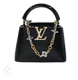 Louis Vuitton | Snakeskin Flower Chain Capucines Mini Bag – Black – product image 1
